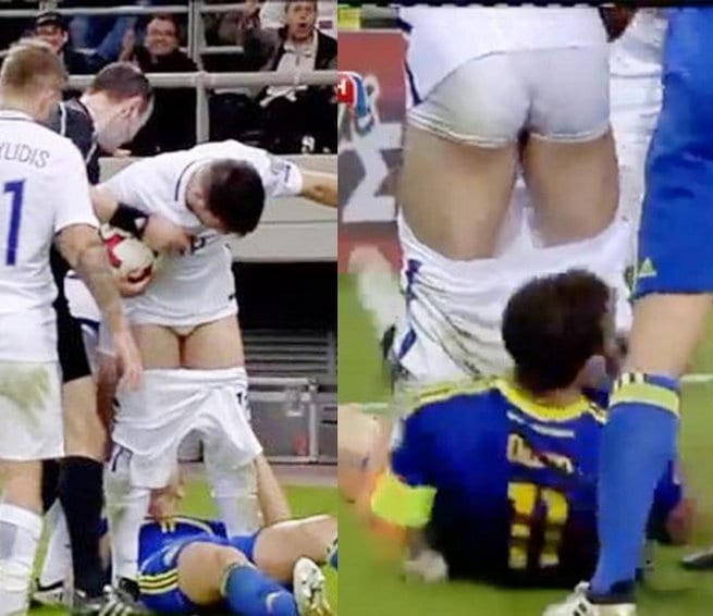 footballer pulls down pants