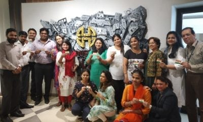 House of Hiranandani team showing the sustainable seed flag