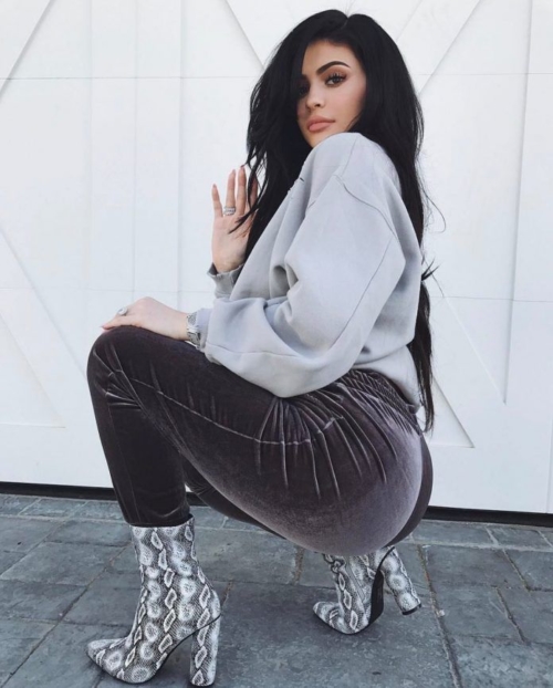 Kylie Jenner's in snake pattern high boots
