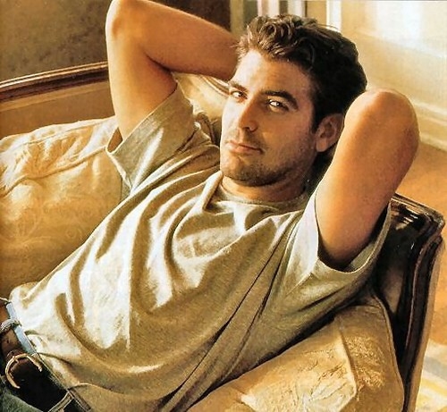 George Clooney being sexy on a couch
